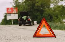 car-with-problems-and-a-red-triangle-to-warn-other-road-users_1157-35969
