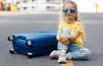 cute-little-girl-with-suitcase-outdoor