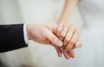 Wedding moments. Newly wed couple's hands with wedding rings