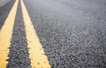 Yellow road marking on road surface