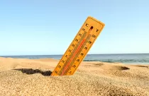 closeup-shot-thermometer-beach-sand_181624-12367