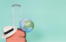 pink-suitcase-with-hat-and-globe-on-it