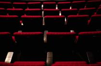 Rows of red seats in a theater