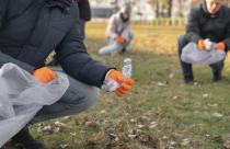 close-up-volunteers-collecting-garbage