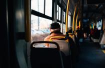 Interior of a city bus with yellow holding rails