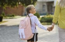 side-view-girl-holding-hands-with-mother