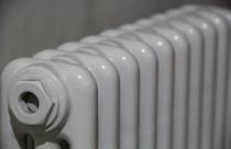 Closeup shot of white radiator on a blurred background