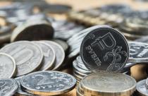 Background blurry out of focus, bokeh, and pasteurization. Coins of the Russian ruble on the table, the change in the exchange rate of the ruble. Idea for economic news banner