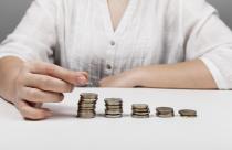 descending-piles-of-coins-and-woman