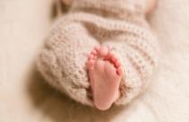 feet-dreamy-child-enveloped-woolen-scarf_1304-4903