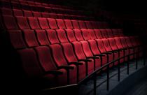 Rows of red seats in a theater