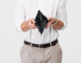 close-up-portrait-of-a-man-showing-empty-wallet