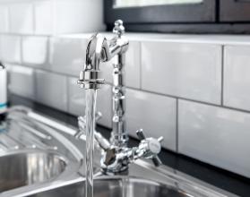 New and modern steel faucet in the kitchen