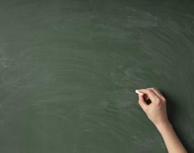 top-view-hand-writing-on-green-board