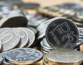 Background blurry out of focus, bokeh, and pasteurization. Coins of the Russian ruble on the table, the change in the exchange rate of the ruble. Idea for economic news banner