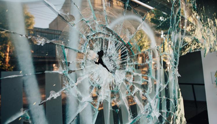 Shop window broken by riots in Chile