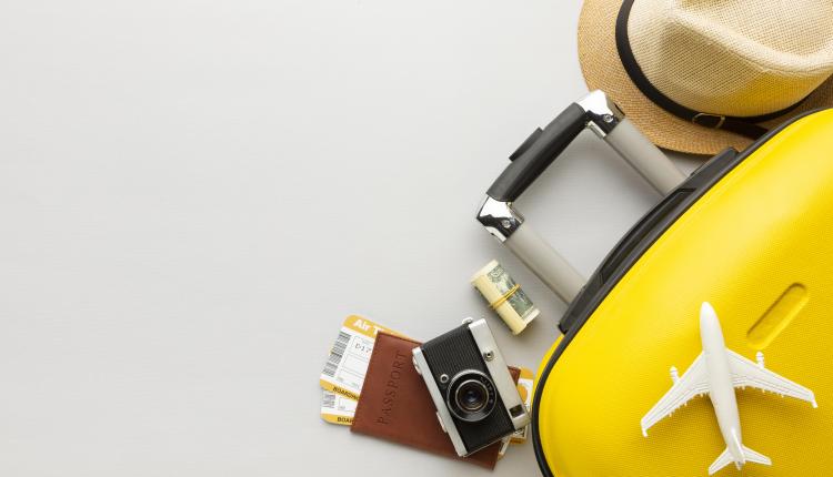 flat-lay-yellow-luggage-with-copy-space (1)