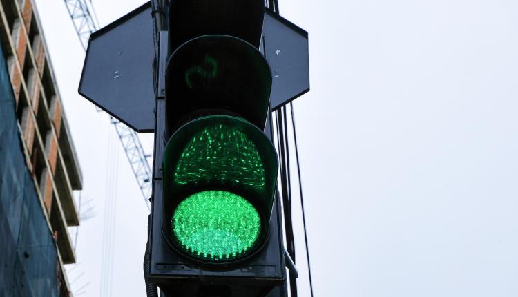 Traffic lights with glowing green