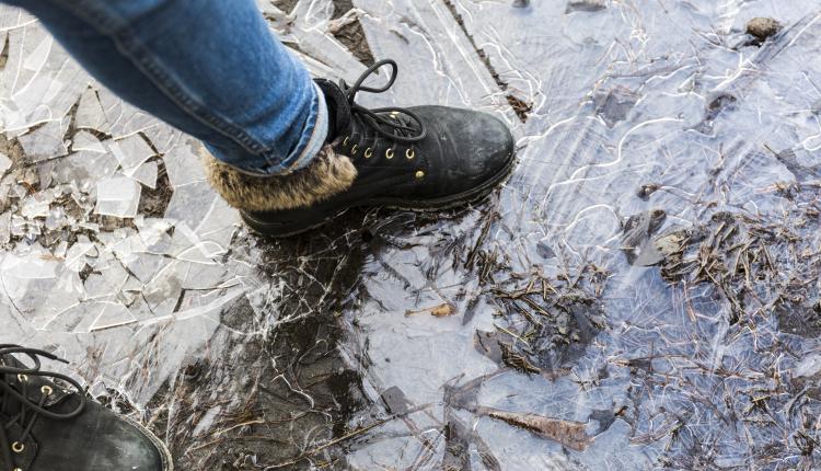 crop-legs-on-frozen-puddle