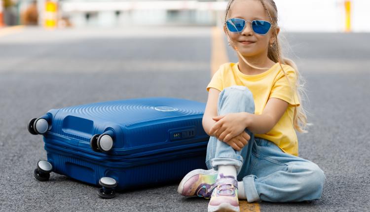 cute-little-girl-with-suitcase-outdoor