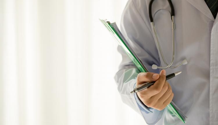 Medical physician doctor man over white background.