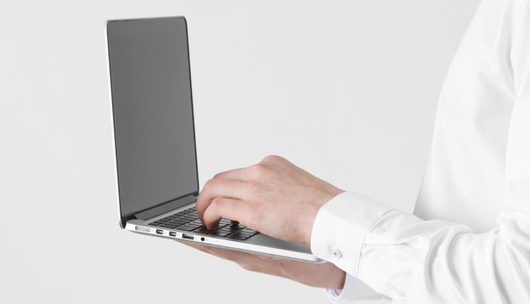 close-up-hands-typing-on-laptop