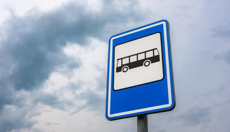 Low angle shot of a bus stop sign