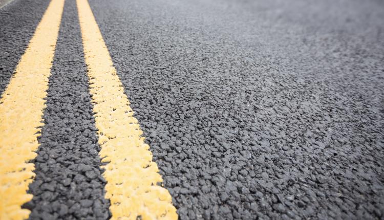 Yellow road marking on road surface