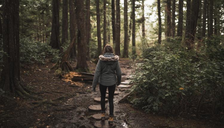 woman-travelling-through-forest