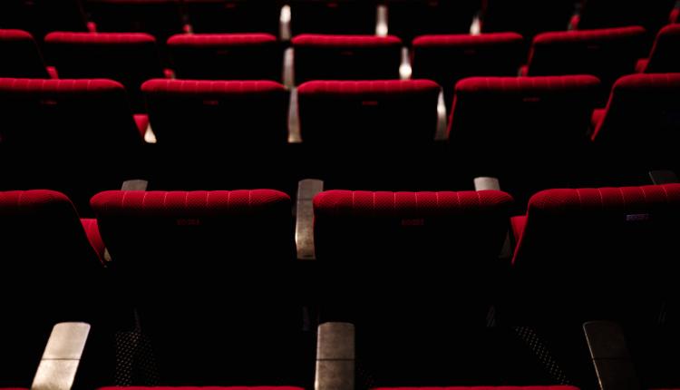 Rows of red seats in a theater