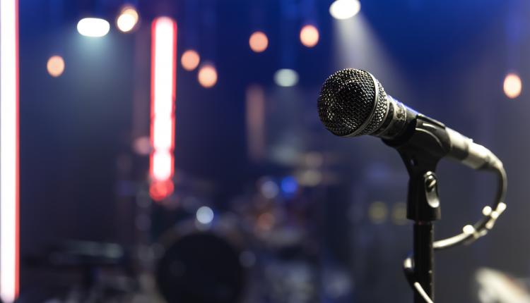 Close up microphone on blurred background with bokeh.