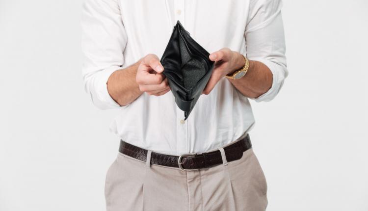 close-up-portrait-of-a-man-showing-empty-wallet