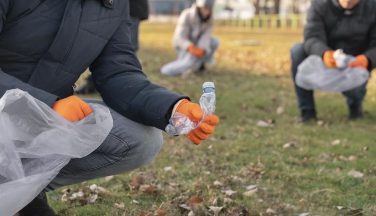 close-up-volunteers-collecting-garbage