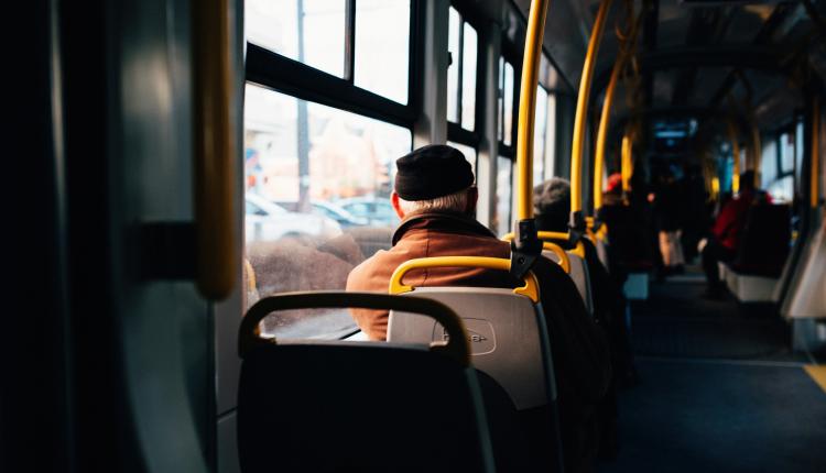 Interior of a city bus with yellow holding rails