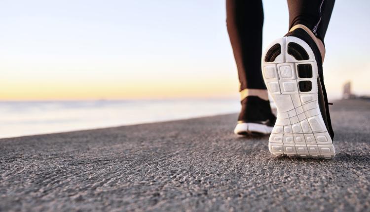 closeup-of-sport-shoes-on-concrete-path