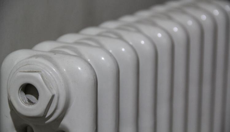 Closeup shot of white radiator on a blurred background