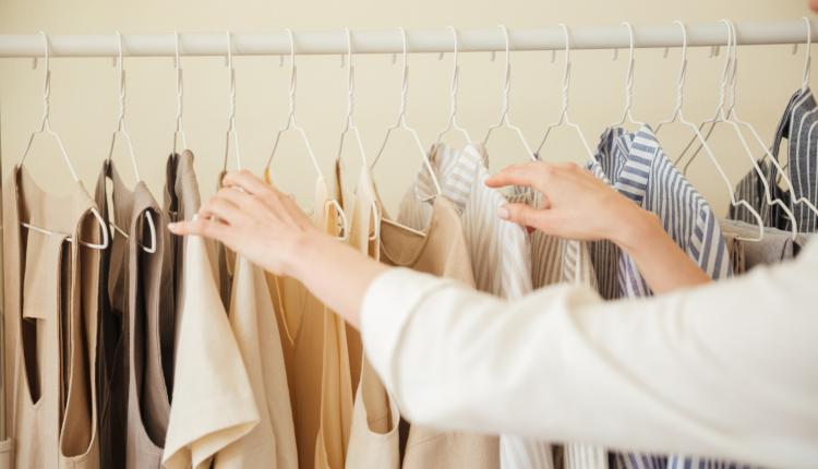 Close up of clothes hanging on rack