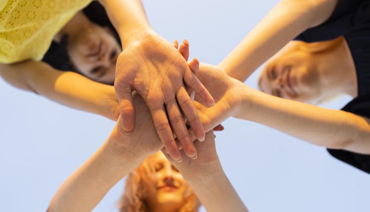 low-angle-of-girls-holding-hands