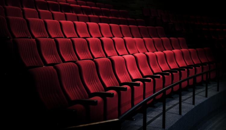 Rows of red seats in a theater